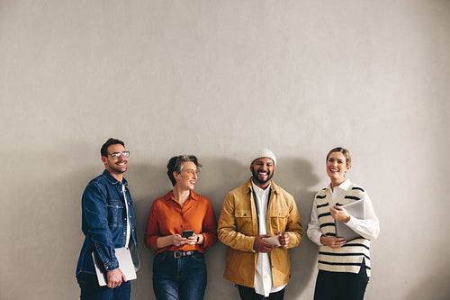 Cheerful job applicants standing in a waiting area