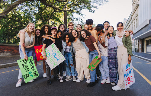 Diverse youth activists holding a climate change protest