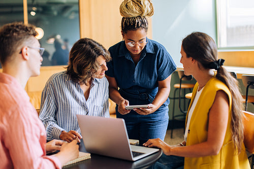 Team discussing ideas in a modern office environment