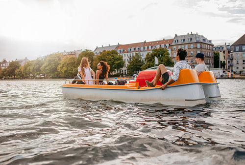 Group of people enjoying boating in the lake