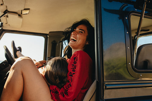 Cheerful couple enjoying on road trip