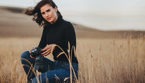 Woman doing landscape photography outdoors