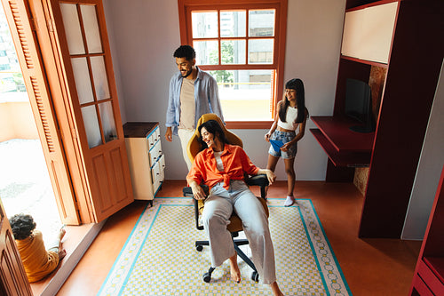 Happy Latino family enjoying quality time together in a colorful home environment