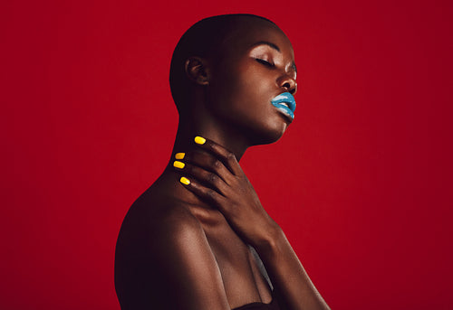 Sensual female model with vibrant makeup