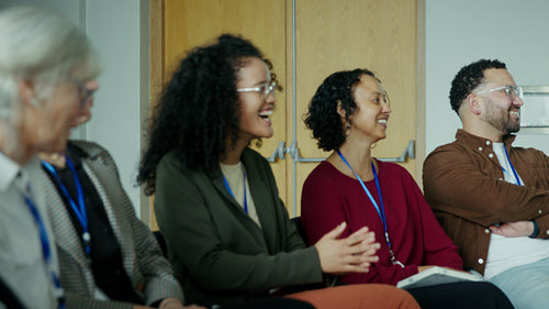 Engaged attendees smiling at conference