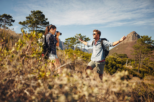 Hikers enjoying on summer vacation in countryside