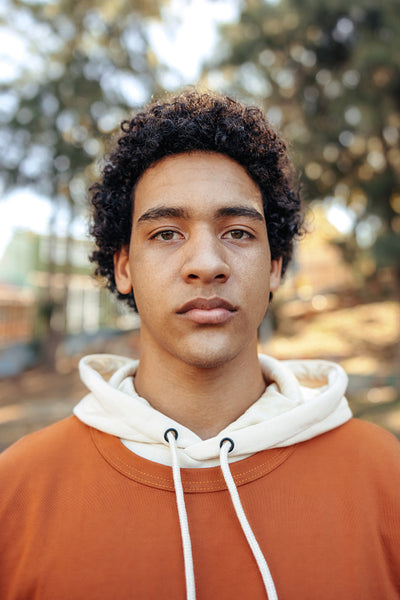 Self-confident teenage boy looking at the camera outdoors