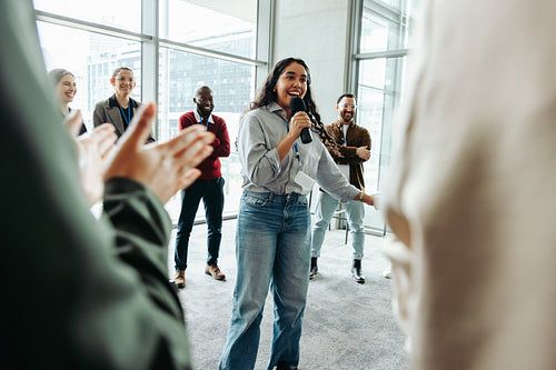 Young businesswoman leading a successful presentation in a modern office
