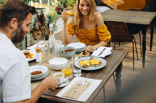 Couple enjoying a tasty breakfast at a hotel