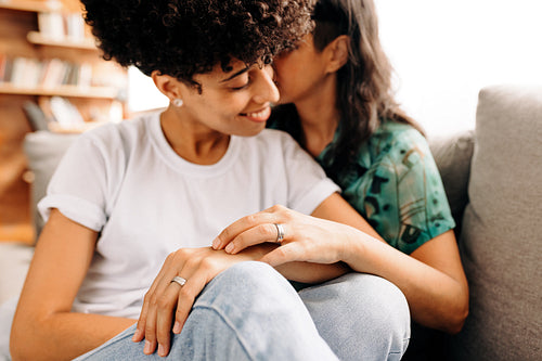 Married female couple bonding at home