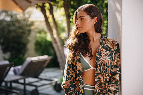 Attractive young woman standing outdoors at a luxury spa