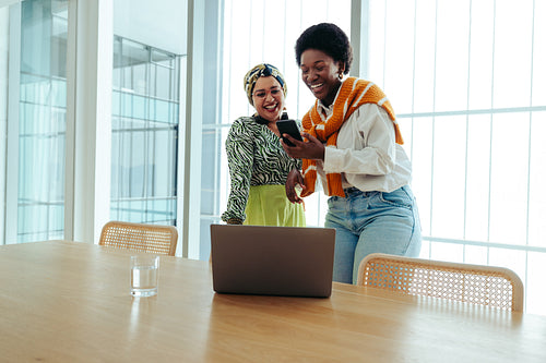 Successful female business partners sharing a moment of collaboration and productivity
