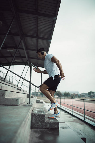 Man working out on stadium steps