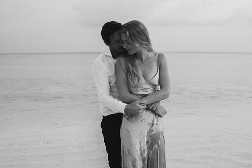 Island serenity: Young couple embracing in love on their wedding day