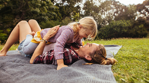 Mother and daughter spending time together at park