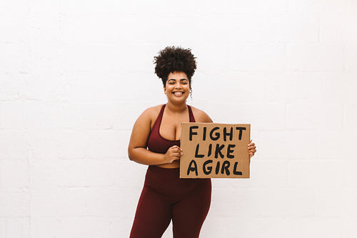 Positive female with "Fight like a girl" banner