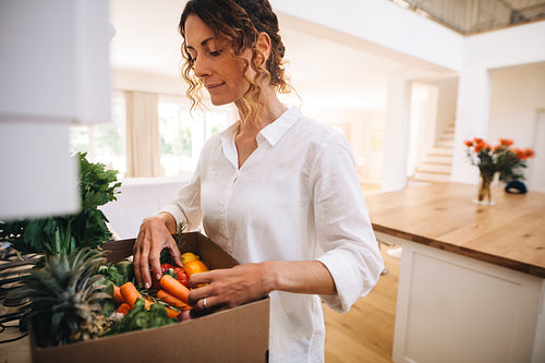 Woman checking online purchased groceries