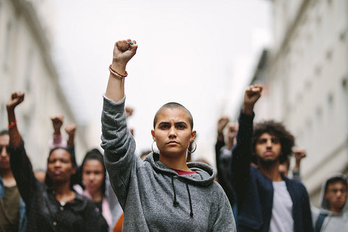 Multi-ethnic people demonstrating on the road