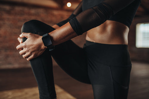 Woman doing stretching workout at gym
