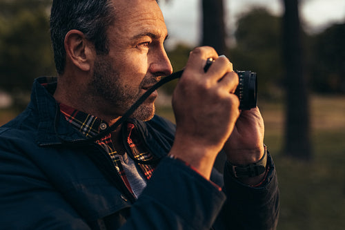 Tourist taking photos standing outdoors