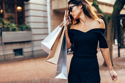 Beautiful woman with many shopping bags