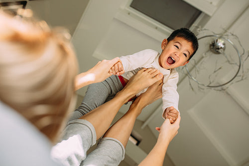 Boy having fun playing with his mother