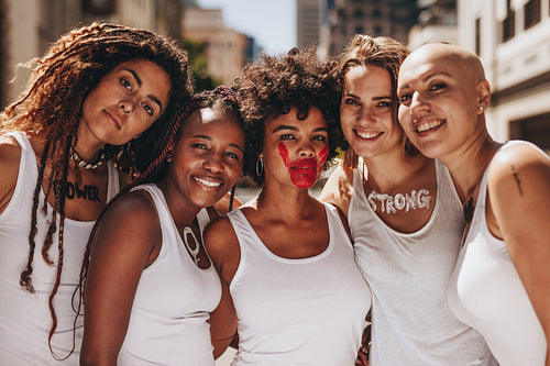 Smiling females protesting for women rights