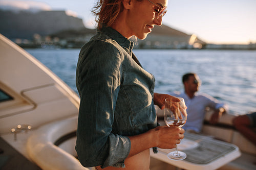 Woman partying on private boat with friends