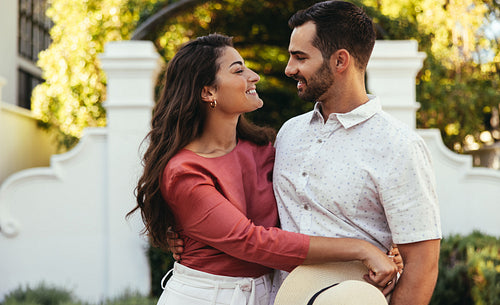 Lovely tourist couple smiling at each other