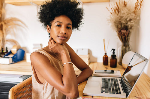 Woman at work desk in jewelry workshop