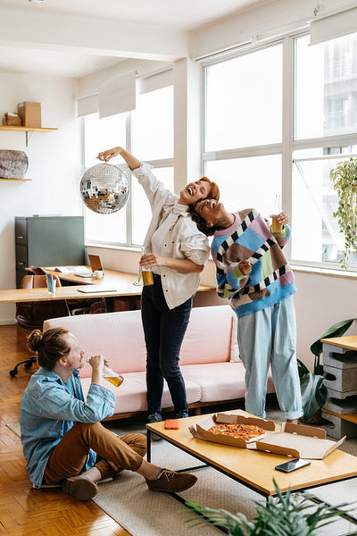 Casual office celebration with colleagues and disco ball