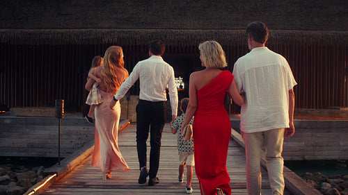Friends and family share a joyful toast during a special evening dinner celebration