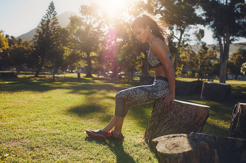 Sportswoman working out in park on a sunny day