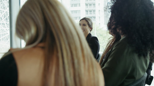 Business professionals clapping at presentation