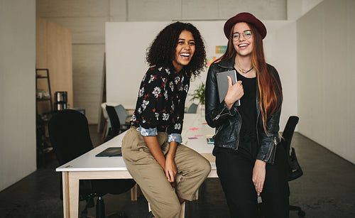 Smiling businesswomen in the conference room at office