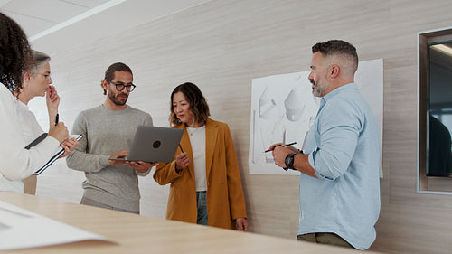 Creative collaboration in a mechanical engineering office: Design professionals working together on a project