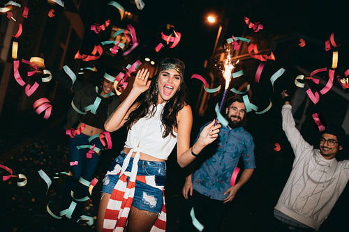 Crazy young friends celebrating new years eve