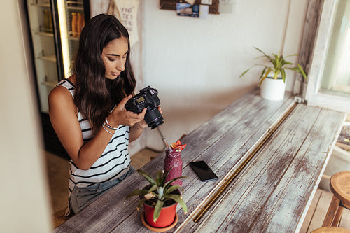 Woman taking photo for her blog