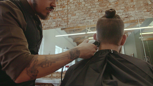 Hairstylist giving a haircut to client