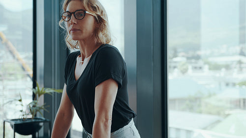 Businesswoman meeting with her team in boardroom