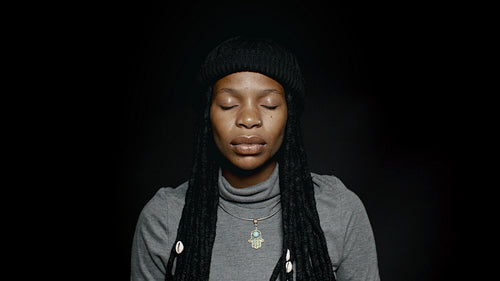 African female with closed eyes