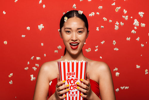 Woman enjoying a movie with popcorn