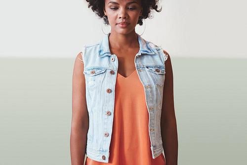 Thoughtful young woman in stylish casuals