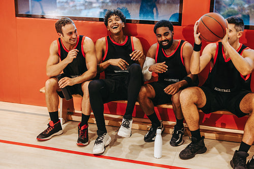 Sideline support: Teammates cheer from the bench