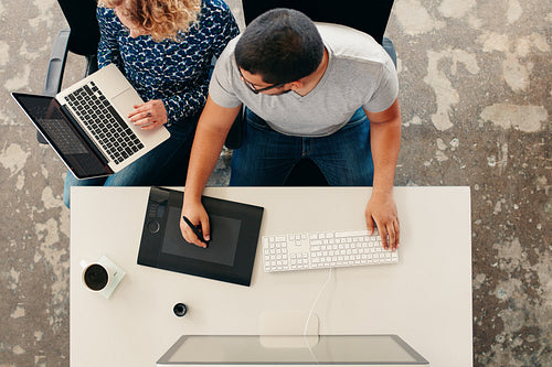 Graphic designers cooperating at work