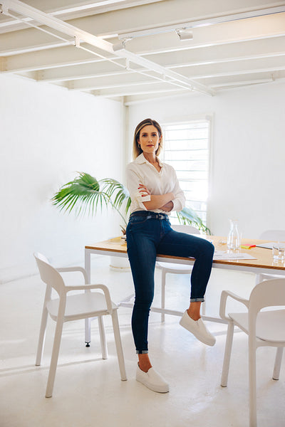 Young businesswoman sitting in a boardroom before a meeting