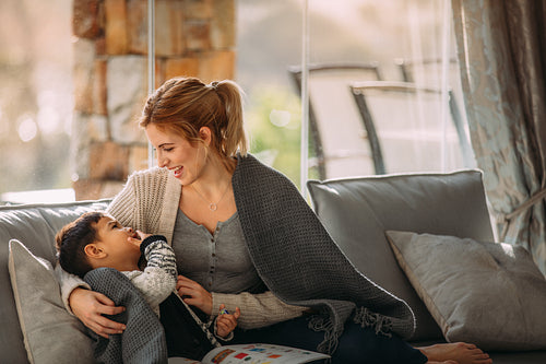 Mother and son having fun time together at home