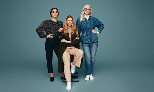 Diverse women smiling at the camera in a studio