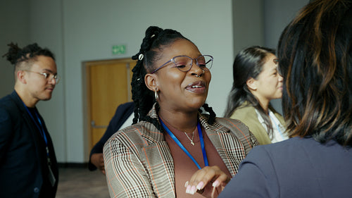 Diverse businesswomen networking and sharing ideas at a professional conference