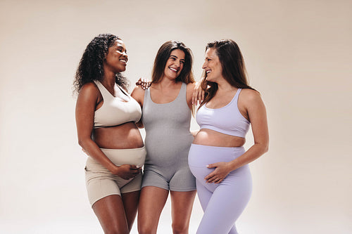 Pregnant moms enjoying an antenatal yoga class together